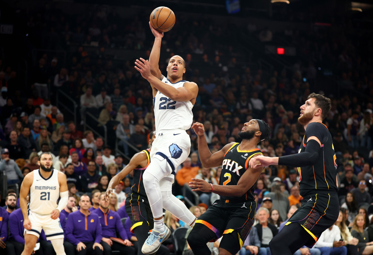 Dec 2, 2023; Phoenix, Arizona, USA; Memphis Grizzlies guard Desmond Bane (22) against the Phoenix Suns in the first half at Footprint Center. Mandatory Credit: Mark J. Rebilas-USA TODAY Sports